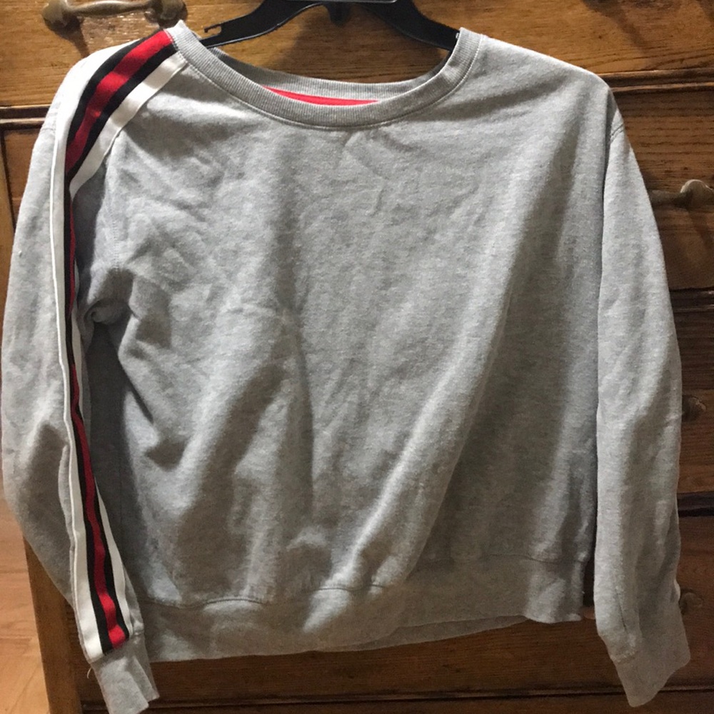 Gray, red and white colored long sleeve.